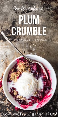 a bowl filled with ice cream sitting on top of a table next to a spoon