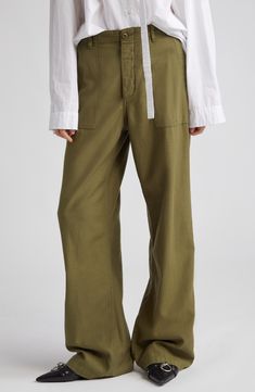 These utility pants are cut in a wide-leg silhouette from Japanese surplus military sateen that's slubbed and treated with an enzyme wash for softness. 32" inseam; 22" leg opening; 13" front rise; 15 1/2" back rise (size 28) Zip fly with button closure Front slant pockets; back button-flap patch pockets 100% cotton Machine wash, tumble dry Imported SPACE: A shop for emerging and advanced designers Spring Military Wide Leg Cargo Pants, Spring Military Style Wide Leg Cargo Pants, Spring Military Wide-leg Cargo Pants, Military Style Wide Leg Relaxed Bottoms, Military Style Wide Leg Bottoms With Relaxed Fit, Military Style Relaxed Fit Wide Leg Parachute Pants, Wide Leg Linen Parachute Pants With Cargo Pockets, Olive Wide Leg Cargo Pants For Work, Linen Straight Leg Cargo Bottoms