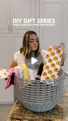 a woman holding a basket full of items with the words diy gift series part 4 holiday hosting basket