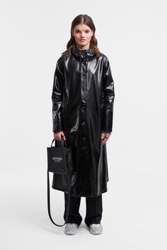 Mosebacke Long Opal Raincoat Black | STUTTERHEIM US Luxury Winter Waterproof Raincoat, Luxury Functional Waterproof Raincoat, Luxury Waterproof Outdoor Raincoat, Luxury Long Raincoat With Detachable Hood, Luxury Modern Hooded Raincoat, Luxury Modern Raincoat, Luxury Winter Raincoat With Double-lined Hood, Luxury Modern Raincoat For Rainy Weather, Luxury Long Sleeve Raincoat For Rainy Weather