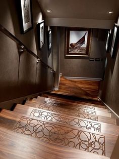 the stairs are made of wood and have decorative designs on them