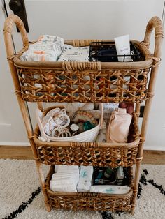 a wicker basket filled with items on top of a rug