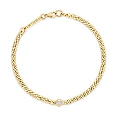 14k small hollow curb chain bracelet with single floating white diamond set in the chain SPECIFICS • 14k small curb chain is fixed at 6.5" or 7" with lobster clasp closure• chain is approx. 3mm wide• round diamond is approx. 3mm• white diamond .10 ctw• available in yellow gold only Curb Chain Bracelet, Jewelry Wardrobe, Zoe Chicco, Chain Bracelets, Diamond Set, Ring Size Guide, Curb Chain, Beautiful Bracelet, White Diamond