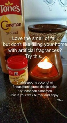 a candle and some jars on a table with information about cinnamon spice in front of it