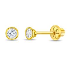 two pairs of yellow gold plated earrings with cubics on each side and a single diamond