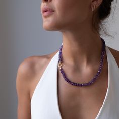 Stunning AAA perfect faceted Amethyst gemstones are hand knotted on a complimentary purple silk cord.  The necklace is finished off with a 14k solid gold clasp which is ideal for adding a charm if you like. This necklace stacks geat with your other favorite necklaces. Detail: ✦ AAA faceted Amethyst gemstones 8mm ✦ 14k solid gold clasp ✦ Hand knotted with silk cord ✦ Measures - choose your length (pictured is an 18 inch necklace) ✦ Packaged in our signature Vivien Frank Black box ready for gift g Gold Amethyst Single Strand Necklace, Gold Amethyst Beaded Necklace With Faceted Beads, Artisan Gold Amethyst Necklace, Luxury Single Strand Amethyst Beaded Necklace, Necklace Stacks, Necklace Packaging, Gold Amethyst Crystal Necklace, Faceted, Necklace Purple, Purple Silk