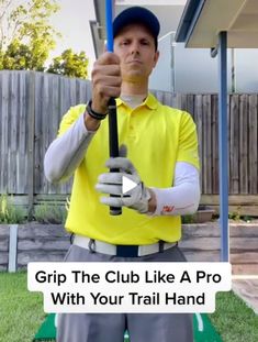 a man in yellow shirt holding up a baseball bat