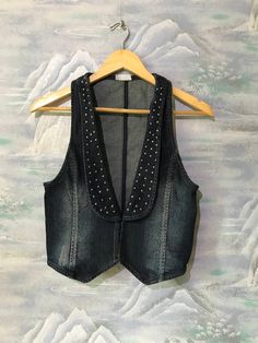 "Vintage Extra Small Size Vest Denim Vest Women Jeans Vest Blue Denim Vest Fitted Waistcoat Jeans Waistcoat Extra Small to Small Waistcoat Label size: 34 Estimated size: XS/S Measurements (lying flat): Length: 19,2\" - 49 cm Pit to pit: 14,5\" - 37 cm Waist: 13,7\" - 35 cm Please check measurements to insure a proper fit. Remember to allow yourself some extra room for movement. You can compare these with something from your closet that fits you well. This vest will come to you freshly laundered Fitted Denim Vest With Pockets For Winter, Fitted Winter Denim Vest With Pockets, Winter Fitted Denim Vest With Pockets, Fitted Denim Top For Winter, Trendy Dark Wash Denim Vest For Winter, Fitted Medium Wash Denim Vest For Winter, Fitted Denim Vest In Medium Wash For Winter, Fitted Dark Wash Denim Vest For Winter, Fitted Denim Vest In Dark Wash For Winter