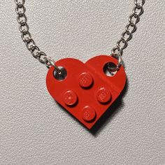 The necklace is handmade by AFOL (An Adult Fan of LEGO) using LEGO plates with a 20inch stainless steel linked chain. May have imperfections. Personalized Red Stainless Steel Jewelry, Red Chain Charm Necklace For Gift, Red Pendant Chain Jewelry, Red Nickel-free Pendant Necklace, Red Stainless Steel Jewelry For Valentine's Day, Red Stainless Steel Pendant Jewelry, Red Pendant Necklace With Chain, Red Stainless Steel Necklace With Adjustable Chain, Red Metal Charm Necklace With Adjustable Chain