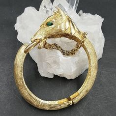 Simply Fabulous And Hard To Find Horse Clamper Bracelet From Castlecliff. The Horse Head Is Detailed And Dimensional, With Green Marquise Rhinestone Eyes And Dangling Chain Reins. The Gold Plated Metal Is Textured And In Excellent Condition. The Hinge Is Tight With Plenty Of "Snap". Inner Measurements Are 2 1/8 By 2", Best Fits A Medium Wrist. Signed Castlecliff Rhinestone Eyes, Horse Head, The Horse, Womens Jewelry Bracelets, Vintage Ladies, Vintage Jewelry, Gold Plate, Horses, Plating