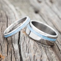 Shown here is a matching wedding band set featuring "Eterna" & "Vertigo" laying together. "Vertigo" is a handcrafted wide wedding band featuring turquoise inlay. "Eterna" is a stacking-style wedding band featuring a turquoise inlay. Turquoise Wedding Bands, Elk Antler Wedding Band, Matching Wedding Band Sets, Turquoise Wedding Band, Antler Wedding Band, Wide Wedding Bands, Matching Wedding Rings, Staghead Designs, Turquoise Wedding