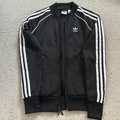 Never Used In Excellent Condition. Size: 2xs. Smoke- Free Home. Black Sportswear Outerwear With Three Stripes, Casual Fall Outerwear With Three Stripes, Casual Three Stripes Outerwear For Fall, Casual Three Stripes Fall Outerwear, Long Sleeve Outerwear With Three Stripes For Spring, Fitted Outerwear With Three Stripes For Fall, Fitted Three Stripes Outerwear For Fall, Adidas Three Stripes Winter Outerwear, Adidas Black Outerwear With Three Stripes Branding