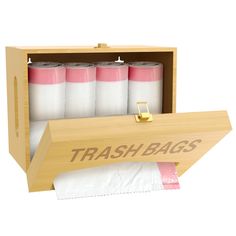 a wooden box with four rolls of trash bags in it and the words trash bags printed on them