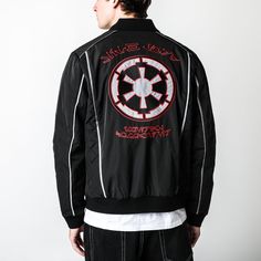 Star Wars Sith Lord Vader Bomber Jacket | Official Apparel & Accessories | Heroes & Villains™ - Star Wars Casual Embroidered Outerwear For Outdoor, Winter Crew Neck Outerwear With Embroidered Logo, Casual Varsity Jacket With Logo Patch, Casual Long Sleeve Varsity Jacket With Logo Patch, Long Sleeve Varsity Jacket With Logo For Streetwear, Varsity Long Sleeve Outerwear With Logo Patch, Casual Track Jacket With Embroidered Logo For Streetwear, Urban Outerwear With Embroidered Logo And Long Sleeves, Urban Long Sleeve Outerwear With Embroidered Logo