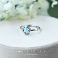 Natural Blue Topaz Adjustable Ring, Sky Blue Gemstone Ring, Vintage Adjustable Sterling Silver Ring Dimension: Adjustable size  Stone 6mm*8mm Please have a look at our store for expanding range of Jewellery. -  Packaging: Each item is packaged in our branded packaging, so your order is ready to be gifted. If the gift item is going straight to the recipient, please make sure leave a comment during checkout so we won't include an invoice.  -  Shipping: All items are ready to be shipped within 2 wo Blue Topaz Ring With Birthstone, Blue Oval Stackable Rings For Anniversary, Blue Oval Stackable Rings, Stackable Blue Birthstone Promise Ring, Oval Blue Sterling Silver Stackable Rings, Blue Oval Stackable Promise Rings, Blue Birthstone Crystal Ring For Promise, Blue Moonstone Birthstone Ring For Promise, Blue Moonstone Birthstone Ring For Anniversary