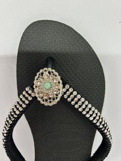 Perfect for Summer Walk at the beach with a pair of comfy & cute flip flops, great for pool and walks  Made with Cristals and a satin lace its super confortable This is Havaianas brand  Size 7 Color Black Size 7/8. Can be made in different colors and sizes. Smoke and pet free Bling Open Toe Sandals For Beach, Adjustable Sandals With Rhinestones For Beach Season, Silver Round Toe Flip Flops For Vacation, Adjustable Rhinestone Sandals For Beach Season, Adjustable Embellished Sandals For Beach Season, Silver Open Toe Flip Flops With Rhinestones, Adjustable Silver Open Toe Flip Flops, Adjustable Silver Flip Flops, Silver Rhinestone Open Toe Flip Flops