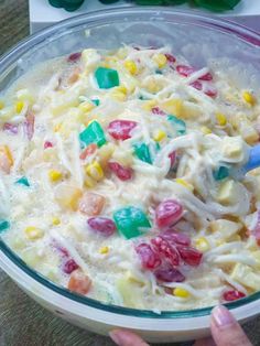 a bowl filled with cereal and candy on top of a table