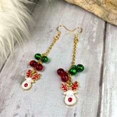 Get In The Seasonal Spirit With These Handmade Dangle Earrings They Feature Darling Enamel Reindeer Charms With Gold Trimming And I Added Gold Pl Chains And Metallic Metal Bells That Jingle Length Is About 3” Long Hypoallergenic Gold Pl French Wire Hooks Comes Gift Boxed Great For The Holiday Season Or As A Gift For Your Coworkers 9/1/24 Christmas Charm Earrings, Christmas Handmade Jewelry, Christmas Earrings Beaded, Nana Earrings, Long Chain Earrings Gold, Holiday Jewelry Ideas, Keychain Designs, Antique Silver Earrings, Gold Bead Earrings