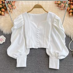 Make a statement in this blouse featuring a sweetheart neckline, loop button up front and oversized puffy blouson sleeves. Slightly cropped. S/M: 36" chest, 15" length White Blouse Crop Top, Top Designs For Women, Expensive Stuff, Blouses Vintage, Teen Outfits, Women White Blouse, Fashion Top Outfits, Fashion Tops Blouse, Trendy Fashion Tops