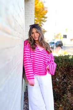 This cuddly Strawberries & Cream Sweater will give you all the comfort and warmth you need this fall! Crafted with a fuzzy material and an oversized fit, it's like getting a hug all day long. Make your wardrobe pop with colors and add this cozy sweater to your collection. Details: V Neckline Balloon Sleeve Oversize Playful Oversized Knit Sweater, Oversized Playful Knit Sweater, Fun Oversized Winter Sweater, Pink Soft Knit Sweater For Loungewear, Pink Sweater For Fall Cold Weather, Pink Sweater For Cold Weather In Fall, Playful Oversized Sweater For Fall, Oversized Playful Sweater For Fall, Trendy Winter Sweater For Lounging