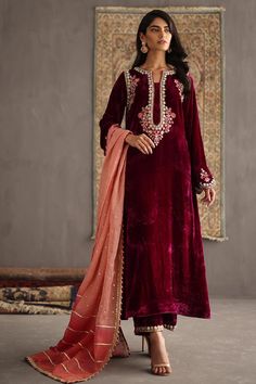 This Attractive velvet Designer Embroidered Kurti paired with velvet pant, a captivating 3-piece Salwar Kameez dress that effortlessly blends tradition with contemporary flair. This beautiful long Kurti set is meticulously crafted for women who appreciate the beauty of intricate details and sophisticated design. For any kind of customization i.e. fabric/color/style and size please message us. Care Instructions : Each product of ours is designed with highest quality standards and delicacy. Handle Bridal Anarkali, Velvet Dress Designs, Velvet Shawl, Velvet Suit, Festive Collection, Velvet Shirt, Anarkali Suits, Designer Dresses Indian, Silk Pants