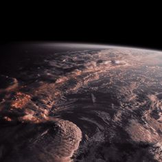 the earth seen from space, with clouds and land in the foreground is an orange glow