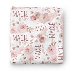 a white sheet with pink flowers on it and the words macie written in red