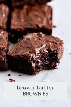 chocolate brownies cut into squares on top of a white surface with the words, brown butter brownies