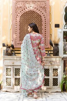 The set consists of printed anarkali kurta with lace detailing on the edges teamed with printed pants and a dupatta with embroidery detailing.The entire set has beautiful lace detailing. Kurta Length-48 inches Palazzo Length-38 inches Dupatta Length-2.5 meters Work-Print Detailing Color-Pink & Light Blue Kurta Fabric-Cotton Bottom Fabric-Cotton Dupatta Fabric-Cotton Model Size- 5.8 tall wearing small size Sleeves - 3/4th Sleeves Neck-Round neck Washing Care-Hand wash or Dry Clean Diwali Lawn Suit With Embroidered Border, Anarkali Cotton Palazzo Set With Printed Border, Bollywood Style Straight Kurta Lawn Suit With Embroidered Border, Bollywood Lawn Suit With Embroidered Border And Straight Kurta, Navratri Lawn Suit With Embroidered Border Straight Kurta, Cotton Anarkali Set With Printed Border For Diwali, Anarkali Lawn Suit With Embroidered Border, Chikankari Embroidery Maxi Sets For Navratri, Festive Mulmul Palazzo Set With Printed Border