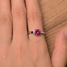 It is a lab ruby ring. The main stone is 7 mm*7 mm round cut.weight about 1.66 carats. The basic metal is sterling silver and plated with rhodium. To change the metal to a solid gold (white/rose) or platinum is also available, please ask for a quotation if you want. You can also go to my shop Home for more elegant rings: https://www.etsy.com/shop/godjewelry?ref=hdr_shop_menu Ruby is the July birthstone. More ruby rings: https://www.etsy.com/shop/godjewelry?section_id=20709238 Customization is al Classic Promise Jewelry With Lab-created Ruby, Classic Lab-created Ruby Jewelry For Promise, Promise Ruby Ring With Prong Setting, Promise Birthstone Ring With Prong Setting, Classic Lab-created Ruby Promise Ring, Lab-created Ruby Rings Round Cut For Gifts, Lab-created Ruby Rings Gift Round Cut, Gift Lab-created Ruby Birthstone Ring With Center Stone, Brilliant Round Cut Lab-created Ruby Jewelry