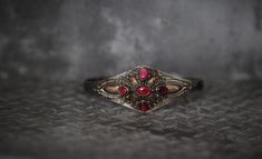 NOW shipping to CANADA. Yay!!  Get in touch if you have issues at check out. Many Blessings VRS Welcome to VintageRetroSuitcase ;-) ! I am delighted you are here to peruse my shop and are curious about this beauty/ these beauties. A quite unique* and Rare* Vintage Ornate Sterling Silver Filigree 18K Gold Accents* with Delightful also rare Raspberry Pink Rhodonite Garnet* Cuff Bracelet*  A true Statement Piece! Here are the details of this specific gem exactly as shown on pictures: Material:  Ste Pink Rhodonite, Pink Raspberry, Garnet Bracelet, Raspberry Pink, Sterling Silver Filigree, Bracelet Cuff, Silver Filigree, Balinese, Gold Accents