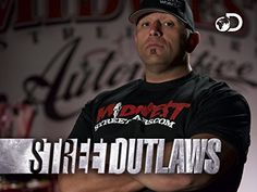 a man with his arms crossed standing in front of a sign that says strip - f out laws