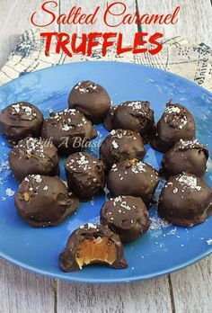 chocolate covered truffles on a blue plate