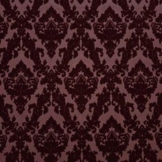 a red and black wallpaper with an ornate design on it's surface,