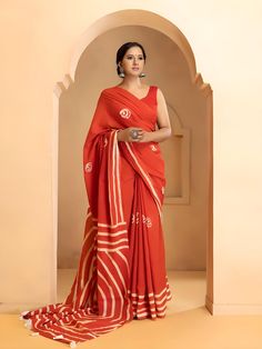 This beautiful handmade Batik print saree is a celebration of traditional Indian craftsmanship. Made from pure cotton, the saree is soft, breathable, and comfortable, perfect for all-day wear. With a length of 6.4 meters, it drapes elegantly, showcasing intricate Batik designs that are both timeless and stylish. The accompanying blouse piece measures 0.90 meters, allowing for a perfect fit. Ideal for both casual and festive occasions, this saree adds a touch of grace and sophistication to any wardrobe. - **Material Pure Cotton for ultimate comfort and breathability. - **Design Traditional Batik print, showcasing intricate handmade designs. - **Saree Length 6.4 meters, providing ample fabric for elegant draping. - **Blouse Piece Includes a 0.90-meter blouse piece, customizable for a perfect Cotton Pre-draped Saree For Puja During Navratri, Festive Cotton Pre-draped Saree With Printed Border, Festive Cotton Traditional Wear With Batik Print, Traditional Batik Print Saree For Diwali, Traditional Drape Saree With Batik Print For Diwali, Bohemian Batik Print Saree For Diwali, Bollywood Style Cotton Pre-draped Saree For Puja, Diwali Batik Print Saree In Traditional Drape, Bollywood Cotton Pre-draped Saree For Wedding