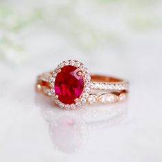 Beautiful Vintage Inspired Ruby Ring ►Base Metal: Sterling Silver (S925) ►Plating: 14K Rose Gold Vermeil ►Accented With Simulated Diamonds ►Can be paired with one or two half-eternity Milgrain bands of your choice Center Stone: Ruby Grade: AAA Stone Cut: Oval Gem size: 8.0 x 6.0 mm Carat Weight: 1.21 ct. Gemstone creation: 100% Genuine Lab-Grown Ruby Stone Origin: Russia ►Please be aware that plated jewelry can wear off over time, if this is a concern we would suggest going with the sterling sil Oval Ruby Ring, December Birthstone Jewelry, Red Gemstones, Ruby Stone, Solid Gold Jewelry, July Birthstone, Fine Jewelry Collection, Anniversary Gift For Her, Ruby Ring