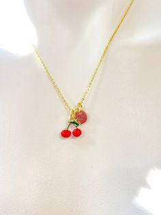 This is gold tone red cherry charm with hand stamped initial charm on brass/stainless steel 18 inches chain. ♥ You will receive 1 necklace. HOW TO ORDER 1) Select the quantity 2) Select the initial  3) Add to cart DESCRIPTION ♥ Necklace, Gold Plated over Brass or Stainless-steel Cable Chain with Lobster Claw Clasp, Size: about 17.7 inches (45cm) long, 1-2mm wide, Nickel Safe, ♥ Initial Charms, Gold Plated over Stainless steel, Size: about 8-10mm in diameter, 1mm thick, Nickel Safe, ♥ Cherry Charm, Brass Enamel Charms, Imitation Fruit, Light Gold, Cherry Charm, Red, Size: about 0.45 inch(11.5mm) wide, 0.47 inch(12mm) long, 0.20 inch(5mm) thick, ♥ We are happy to help with any situation so please reach out with any concerns. ♥ Materials from the USA and international sourcing. ♥ I do not inc Cute Red Charm Necklace For Gift, Cute Red Charm Necklaces For Gifts, Red Dangle Charm Necklaces, Cute Handmade Red Charm Necklaces, Cute Red Handmade Charm Necklace, Cute Handmade Red Charm Necklace, Red Charm Necklace With Adjustable Chain For Gift, Cute Gold Jewelry For Christmas, Red Charm Necklace With Adjustable Chain As A Gift