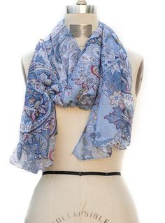 This Beautiful Scarf is a must have Color: Different shades of blue/gold/red/white Delicate paisley print Can be worn as a shawl, wrap or scarf Sheer lightweight fabric Fabric: 100% Polyester Measurement: 26"W x 70"L Wash Instructions: Hand wash or Dry clean Blue Bohemian Scarf With Paisley Print, Blue Bohemian Scarves With Floral Print, Blue Bohemian Paisley Print Scarves, Blue Paisley Print Bohemian Scarf, Different Shades Of Blue, Beautiful Scarf, Scarf Sale, Just Style, Scarf Poncho