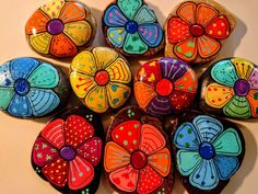 a group of painted rocks sitting on top of a table