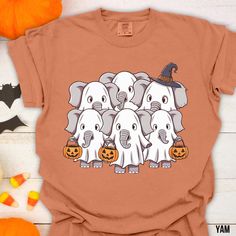 Add a touch of spooky-cute charm to your wardrobe with our adorable shirt featuring a graphic of elephants dressed in ghost costumes trick or treating. This fun and festive design is perfect for adding a pop of Halloween spirit to your outfit. Crafted from comfortable and high-quality materials, this shirt is sure to become a favorite in your fall rotation. Get ready to turn heads and spread some Halloween cheer with this unique and whimsical graphic tee! .: The Comfort Colors 1717 tee is made w Elephant Halloween, Elephant Dress, Ghost Costume, Costume Shirts, Cute Elephant, Trunk Or Treat, Halloween Trick Or Treat, Cute Charms, Halloween Hacks