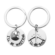 two metal key chains with the words, i'll be waiting for you to fly