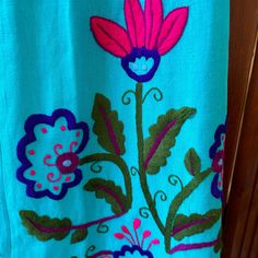 a blue towel with pink flowers on it