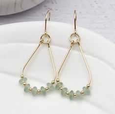 "Handmade Gold Hoops - Stand out from the crowd with these bold earrings! These gold and soft green Aventurine teardrop hoops are sure to make a statement. Enjoy the opulence of the natural Aventurine stone and the sleek design - they'll will go with anything! * Approximately 1.75\" long * Made with 14k Gold Filled wire * Genuine Green Aventurine Gemstones * Polished to a high shine * Handmade in Montana * Sent in a ribboned gift box with polishing cloth ----- OUR MATERIALS -----  *STERLING SILV Green Statement Earrings, Silver Threader Earrings, Boho Hoop Earrings, Bijoux Fil Aluminium, Brown Earrings, Aventurine Stone, Wire Jewelry Designs, Bold Earrings, Handmade Earrings Beaded