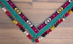 "almost 14.00 cm x 148.00 cm = 5.51\" x 58.27\" red white black green pink yellow purple orange 1940s - 50s from Uzbekistan handmade tassel - segusha dry clean only VINTAGE UZBEK TASSELS : \" Segusha \" ( Triangle ) is a decorative embellishments, whose function, was to decorate the beddings tucked away folded against the walls of a yurt or tent. These objects made with great care were attached on the corner of squarish textiles and used as covers . The silk tassels with beads and metal work are Bohemian Dupatta With Border For Festivals, Bohemian Festive Dupatta With Tassels, Traditional Dupatta With Tassels For Festivals, Bohemian Dupatta With Motifs For Festival, Multicolor Dupatta With Latkans For Traditional Ceremonies, Bohemian Festival Dupatta With Traditional Patterns, Vintage Latkans Jewelry For Festive Occasions, Festive Multicolor Tasseled Dupatta, Traditional Tassel Dupatta For Festivals