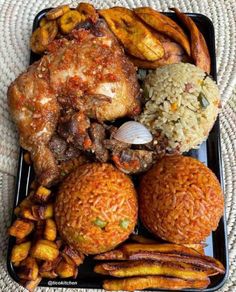 a black tray topped with different types of food