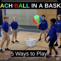 a group of young boys standing on top of a basketball court next to a ball