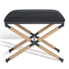 a black stool with four wooden legs and a seat cushion on the bottom, in front of a white background