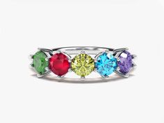 Show your love in a colorful way with our round-shaped birthstone ring, customizable with the birthstones of your choice. A stylish and meaningful gift for mothers and grandmothers to celebrate Mother's Day and their infinite love. FEATURES Gemstone: AAA-Grade Lab-Grown Gemstones Setting Types: ProngShape: Round Cut: ExcellentStone Sizes: 5 x 4.00 mm (1.25 ct)Band width: Min: 1.90 mm, max: 5.70 mmBand thickness: Min:1.65 mm, max: 2.40 mmReady to Ship: 4-5 Business Days Model Name: ECWB000199Avai Multicolor Birthstone Ring With Prong Setting As Gift, Rainbow Birthstone Ring For Anniversary, Multi-stone Birthstone Ring For Birthday, Multicolor Prong Set Round Birthstone Ring, Multicolor Birthstone Ring With Center Stone As Gift, Multicolor Prong Set Birthstone Ring, Multicolor Birthstone Ring With Accent Stones For Anniversary, Mother's Day Birthstone Ring With Gemstone, Birthday Multi-stone Birthstone Ring