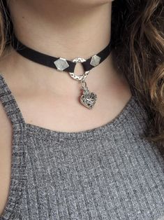 "Black Choker-Heart Choker-Choker Necklace-O Ring Choker-Circle Ring Choker-Punk Choker-Thick Black Choker-Black Necklace-Women Heart Jewelry ❤ BUY ANY 2 ITEMS ANS GET 15% OFF!! (USE COUPON CODE '15OFF') ❤ ❤ BUY ANY 4 ITEMS ANS GET 20% OFF!! (USE COUPON CODE '20OFF') ❤ ❤ BUY ANY 6 ITEMS AND GET 25% OFF!! ((USE COUPON CODE '25OFF') ❤ Complete your outfit with this gorgeous fashionable and trendy heart choker necklace ! Made from 10mm suede leather cord and 31mmx19mm antique silver heart charm. Ch Thick Black Choker, Gothic Accessories Jewellery, Leather Choker Collars, O Ring Choker, Heart Choker Necklace, Black Choker Necklace, Heart Choker, Ring Der O, Circle Ring