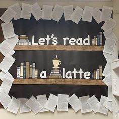 there is a sign that says let's read and a latte on it